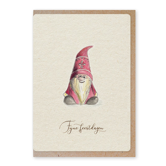 Een mooie duurzame enkele kaart met een tafereel van een tomte / kerstkabouter in aquarel voor een Kerstgroet of een Nieuwjaarswens. De illustraties zijn gemaakt in onze grafische studio. Gedrukt op Paperwise Naturel, boomvrij papier van landbouwrestafval. 