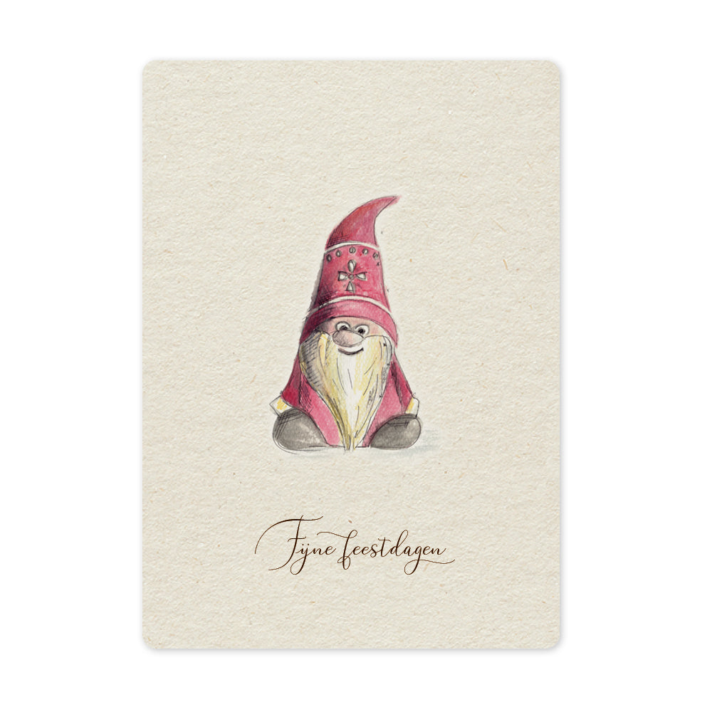 Een mooie duurzame enkele kaart met een tafereel van een tomte / kerstkabouter in aquarel voor een Kerstgroet of een Nieuwjaarswens. De illustraties zijn gemaakt in onze grafische studio. Gedrukt op Paperwise Naturel, boomvrij papier van landbouwrestafval.&nbsp;