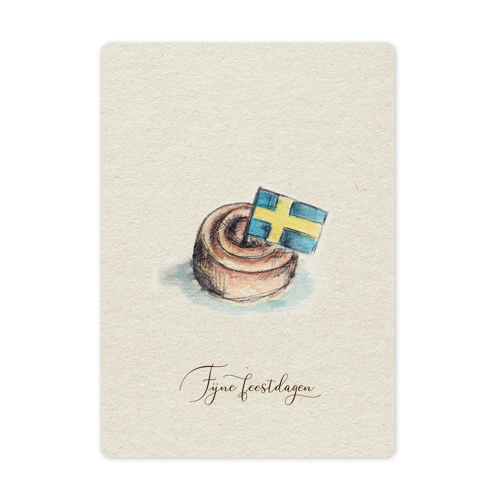 Een mooie duurzame enkele kaart met een tafereel van een Zweeds kaneelbroodje kanelbulle in aquarel voor een Kerstgroet of een Nieuwjaarswens. De illustraties zijn gemaakt in onze grafische studio. Gedrukt op Paperwise Naturel, boomvrij papier van landbouwrestafval.&nbsp;