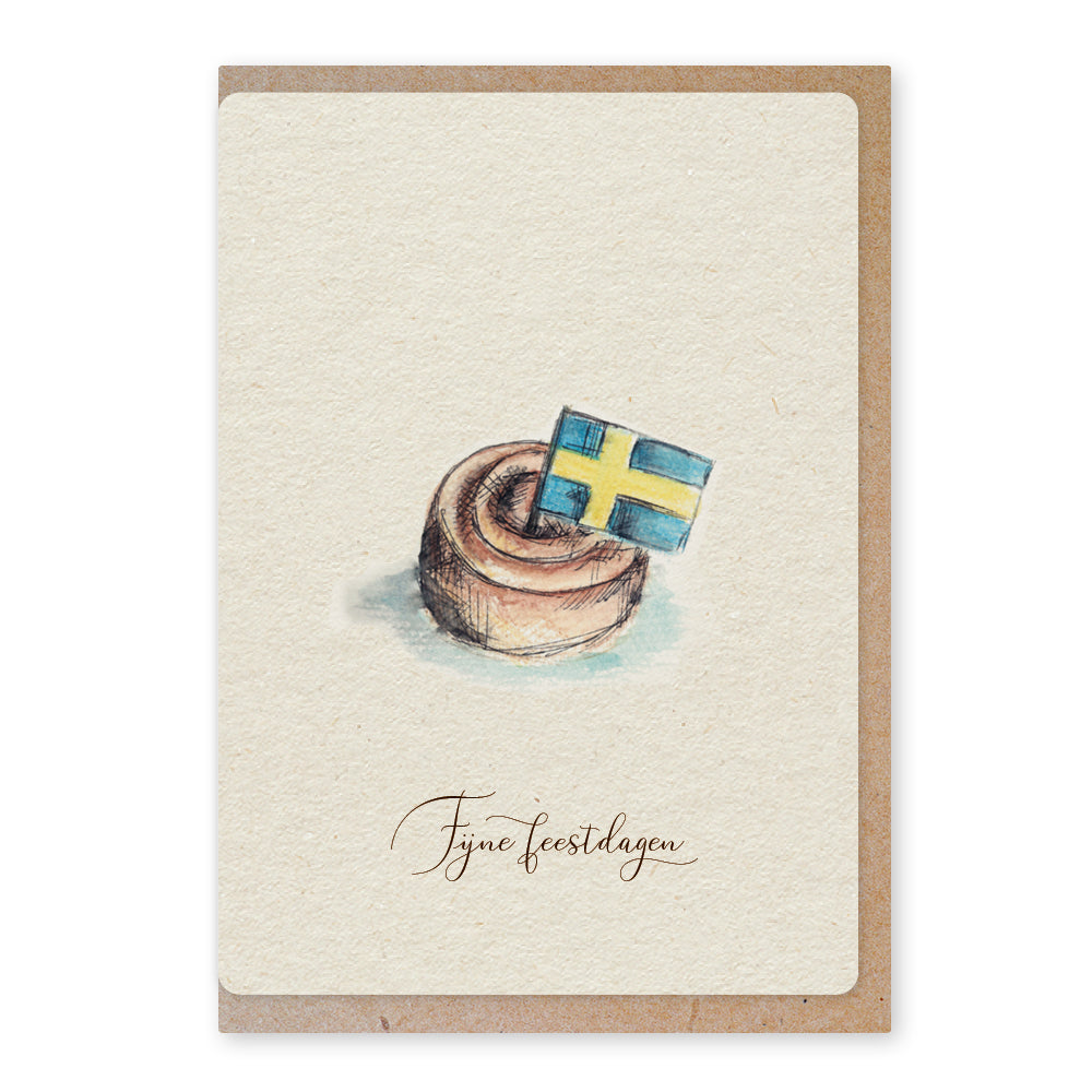 Een mooie duurzame enkele kaart met een tafereel van een Zweeds kaneelbroodje kanelbulle in aquarel voor een Kerstgroet of een Nieuwjaarswens. De illustraties zijn gemaakt in onze grafische studio. Gedrukt op Paperwise Naturel, boomvrij papier van landbouwrestafval.&nbsp;