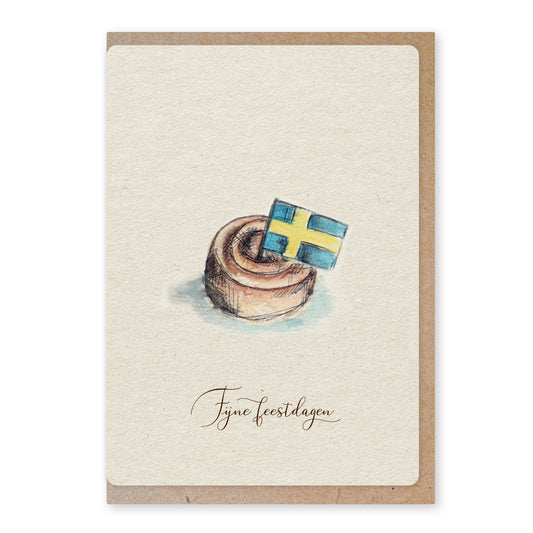 Een mooie duurzame enkele kaart met een tafereel van een Zweeds kaneelbroodje kanelbulle in aquarel voor een Kerstgroet of een Nieuwjaarswens. De illustraties zijn gemaakt in onze grafische studio. Gedrukt op Paperwise Naturel, boomvrij papier van landbouwrestafval.&nbsp;